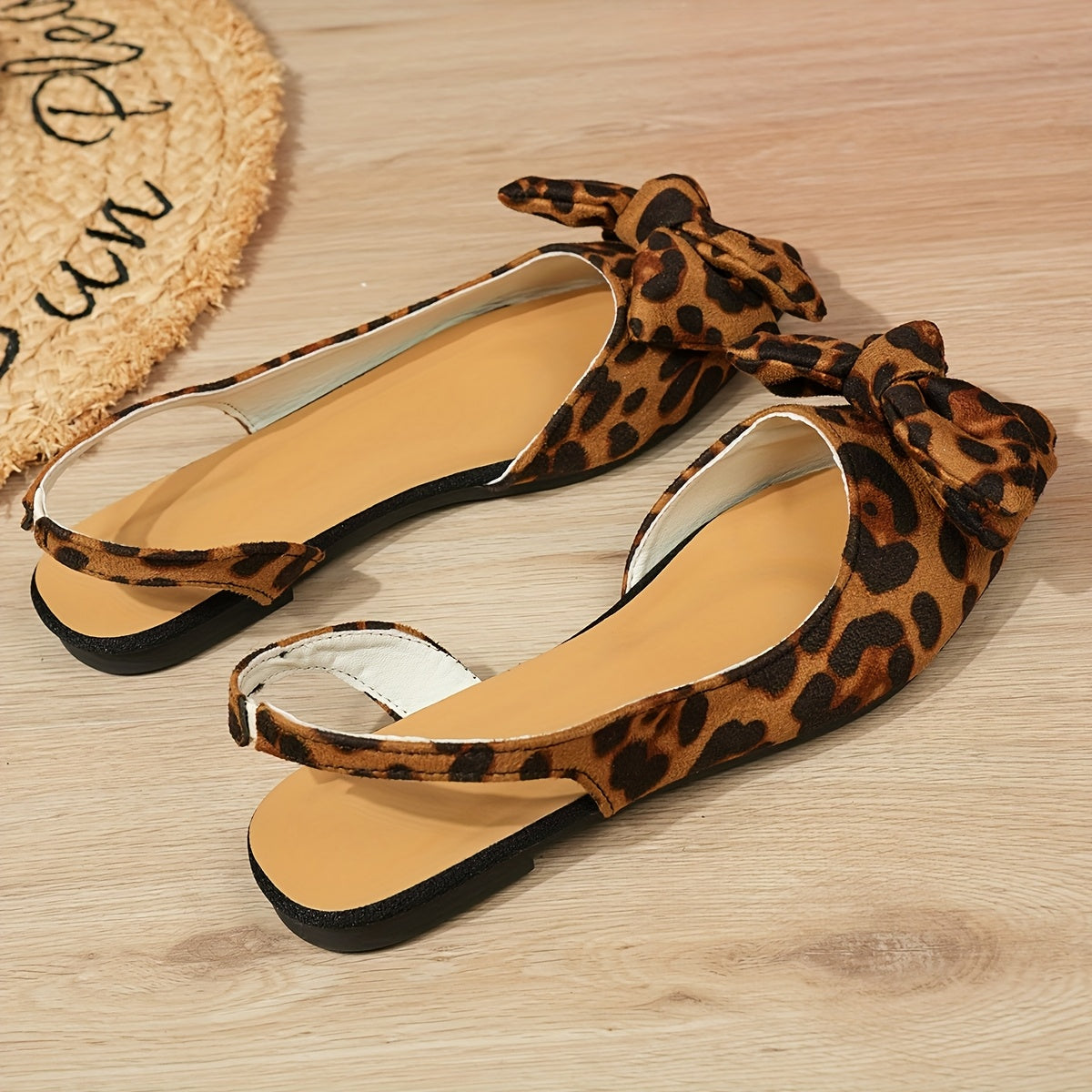 Women's bow-knot flat sandals with pointed toe, fabric upper, and rubber sole for all seasons.