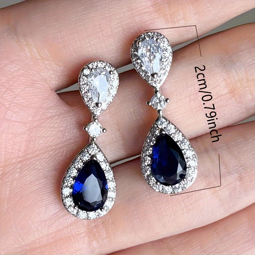 Exquisite and premium jewelry designed for women, showcasing a stunning water drop-shaped silvery earring adorned with shimmering zirconia stones. This elegant piece weighs around 3.9 grams and is ideal for special occasions and evening gatherings. A