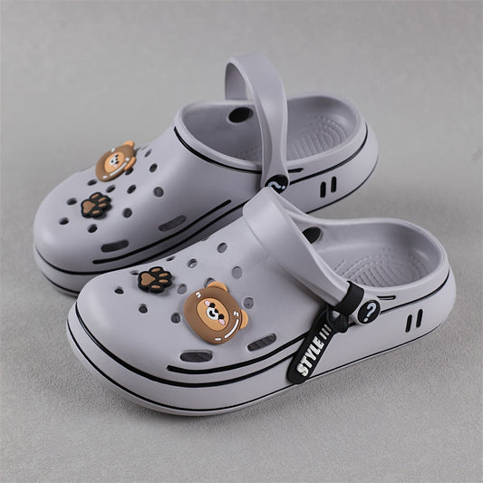 Durable outdoor slippers for boys featuring cartoon theme and comfy sole.