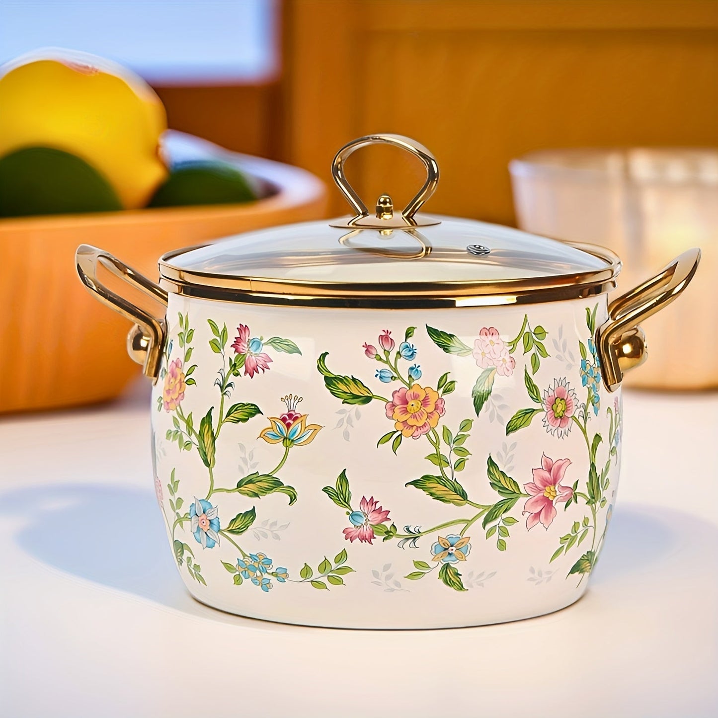 Large capacity enamel saucepan with glass lid and floral design is a non-stick, dishwasher-safe kitchen cookware with double handles. This soup pot features a golden handle for added style and convenience.