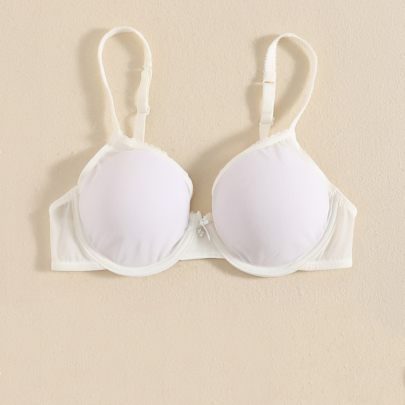 Sheer unlined bra for women in white, breathable nylon and spandex with underwire and thin straps. Hand wash only. Perfect for everyday comfort and sensual style.