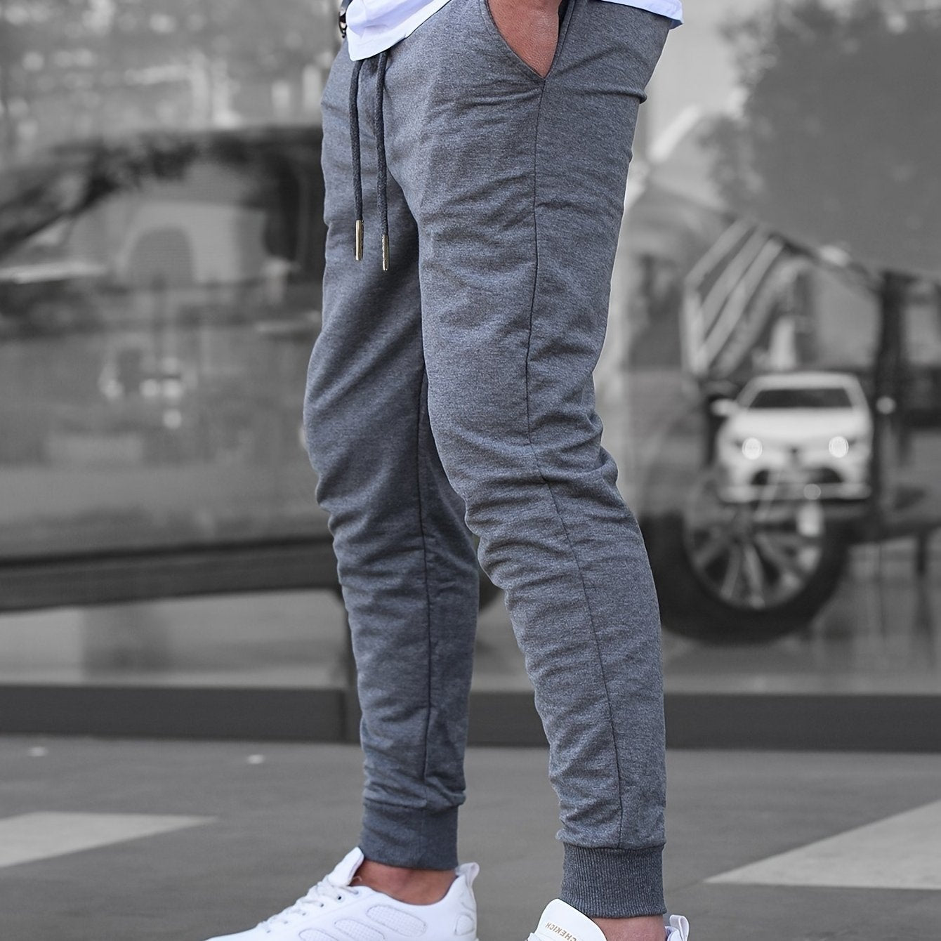 Solid color jogger pants for men with drawstrings, lightweight and breathable for running and fitness.