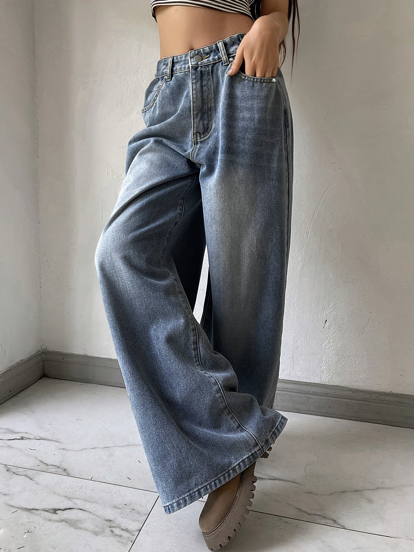 Water washed blue extra long wide leg jeans for women, perfect for casual autumn wear.