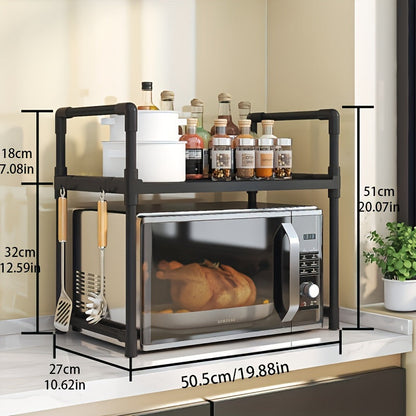 A modern kitchen storage shelf with stainless steel microwave stand and double layer, multi-layer oven rack organizer. Made with metal and plastic materials, this contemporary all-in-one piece is perfect for the dining room and requires no assembly.