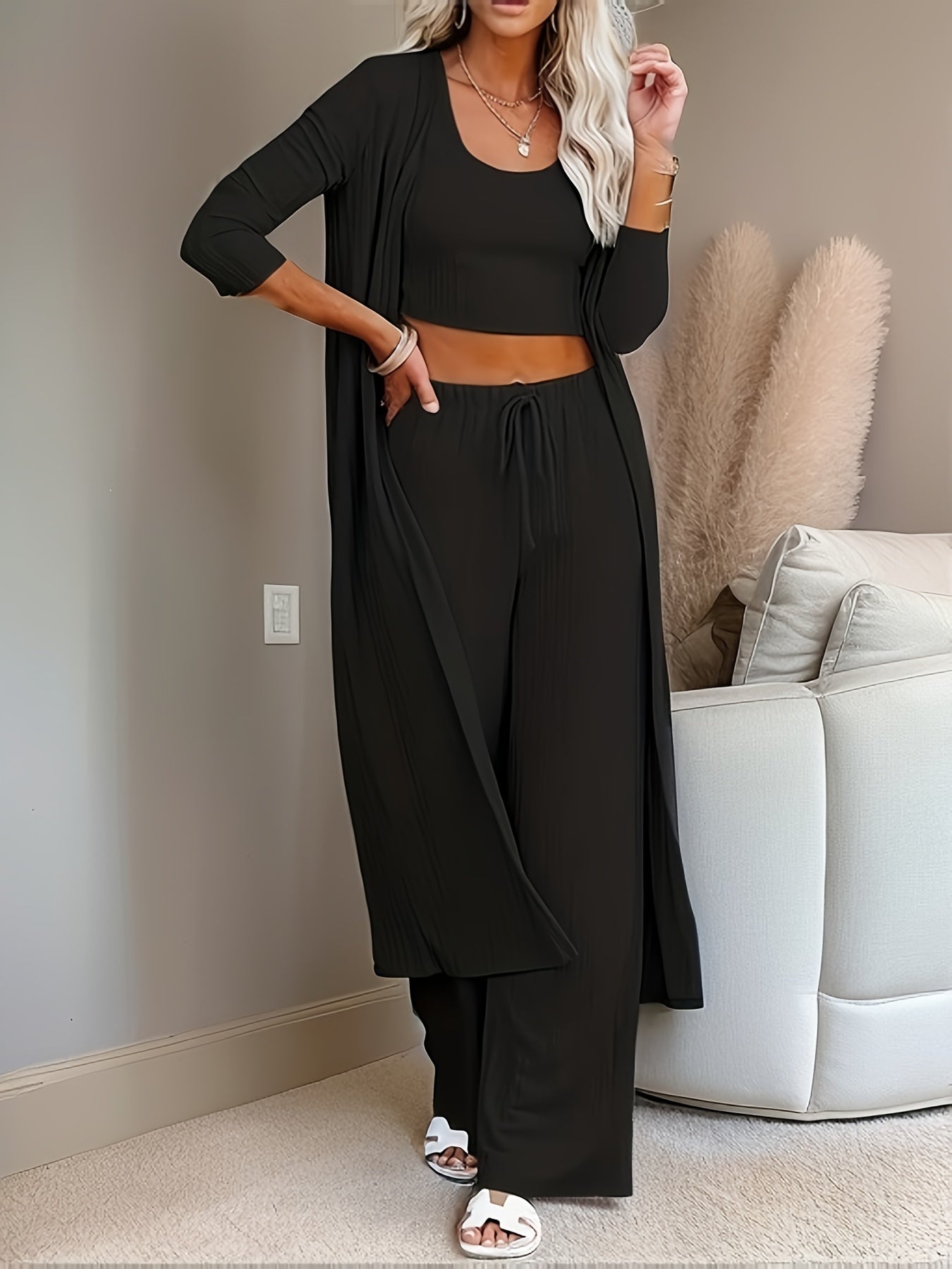 Women's 3-piece casual pajama set with long sleeve round neck top, solid color knit polyester lounge wear, faux drawstring detail, and long pants suitable for all seasons.