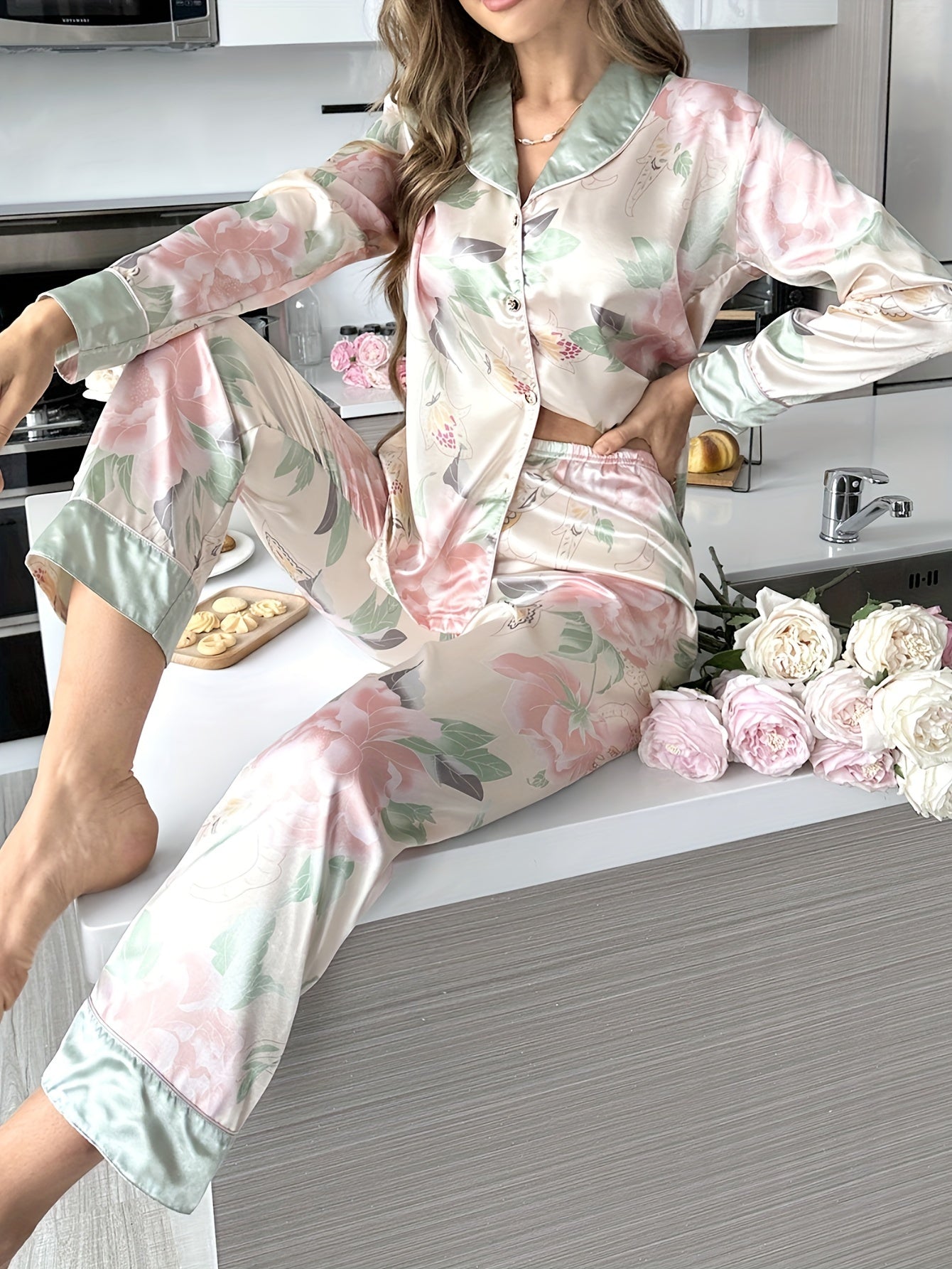 Women's soft satin pajama set with elegant floral print, long sleeve top and pants, perfect for indoor and outdoor wear.