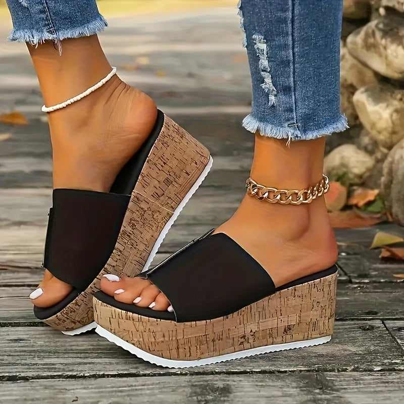 Black slide sandals for women with wood grain sole, open toe, high wedge heel, vegan cover strap, and platform style for summer.