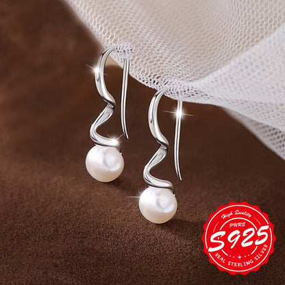 These women's wavy pearl ear hooks are crafted from S925 sterling silver and inlaid with natural pearls. They are elegant and fashionable accessories that can be worn on a daily basis for various occasions. The hypoallergenic design makes them suitable