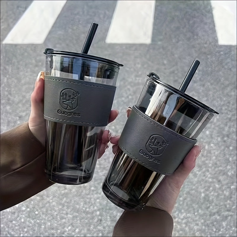 Stylish bamboo-inspired glass mug with straw, ideal for coffee and milk tea