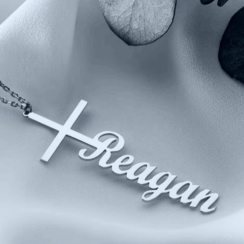 Personalize a name necklace pendant featuring a Middle Eastern style cross. Crafted with elegant stainless steel, this piece is perfect for everyday wear or music festivals. Share warm messages at parties or on vacation with this trendy and elegant