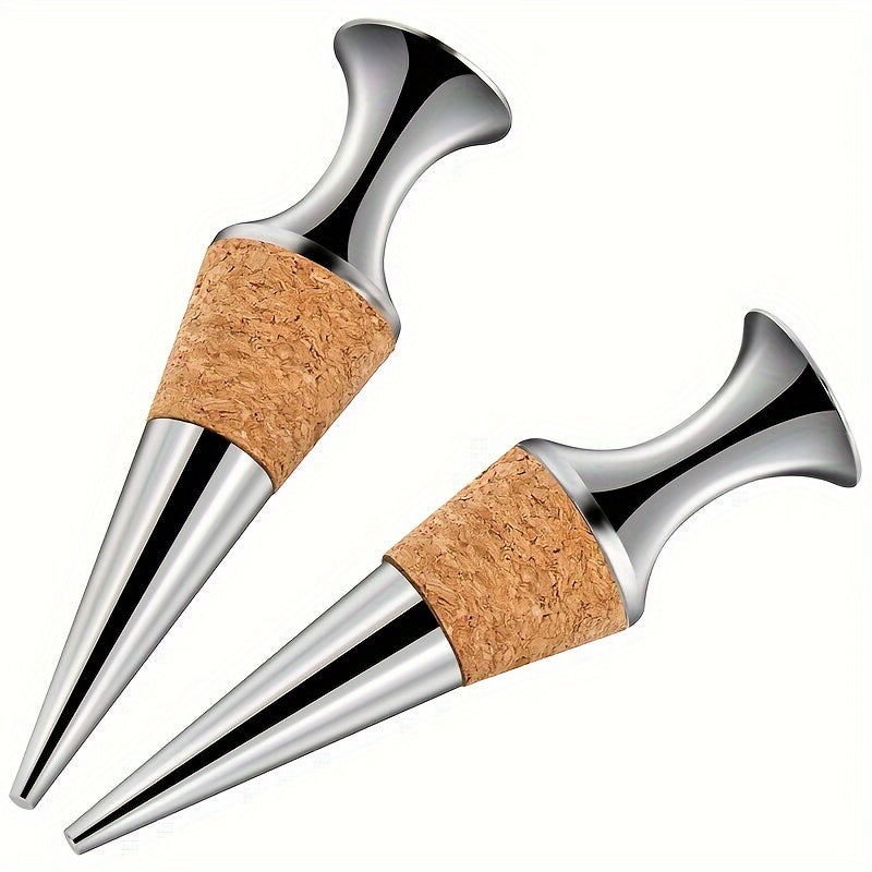 Two silver wine stoppers with wooden plugs.