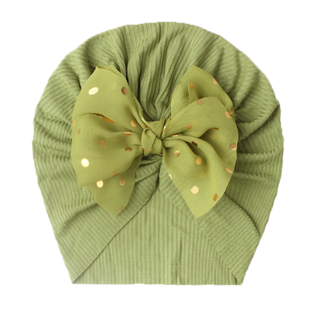 Polka dot printed bow head wrap for newborn infants and toddlers.