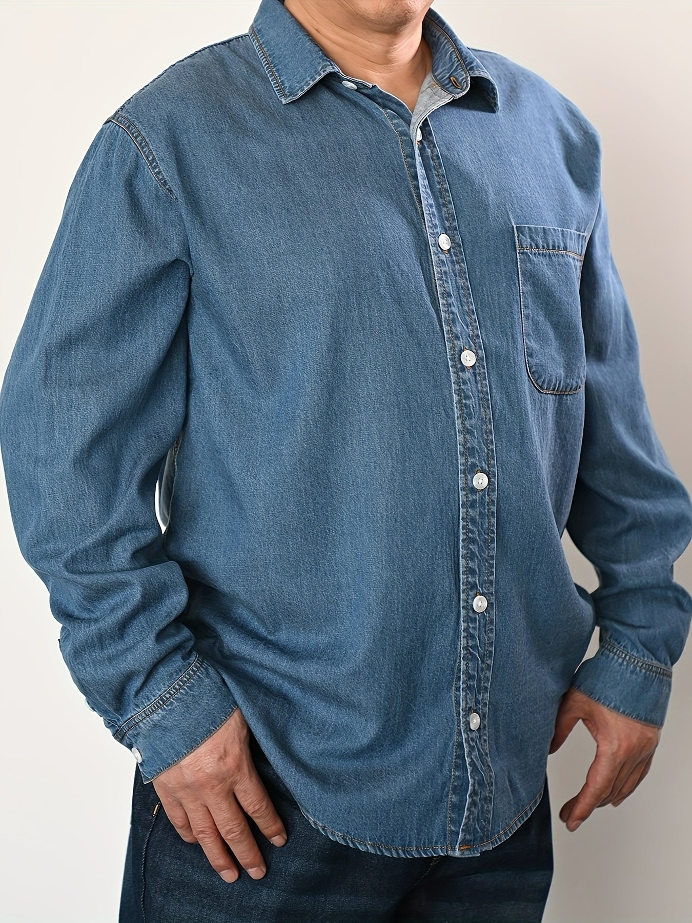 Men's plus size denim shirt, perfect for outdoor activities in spring and fall. Stylish, loose fit and breathable.