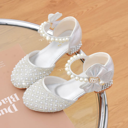 Spring and summer children's high heels with pearl crystal shoes featuring bowknot and butterfly knot for girls, perfect for catwalk shows and formal occasions.