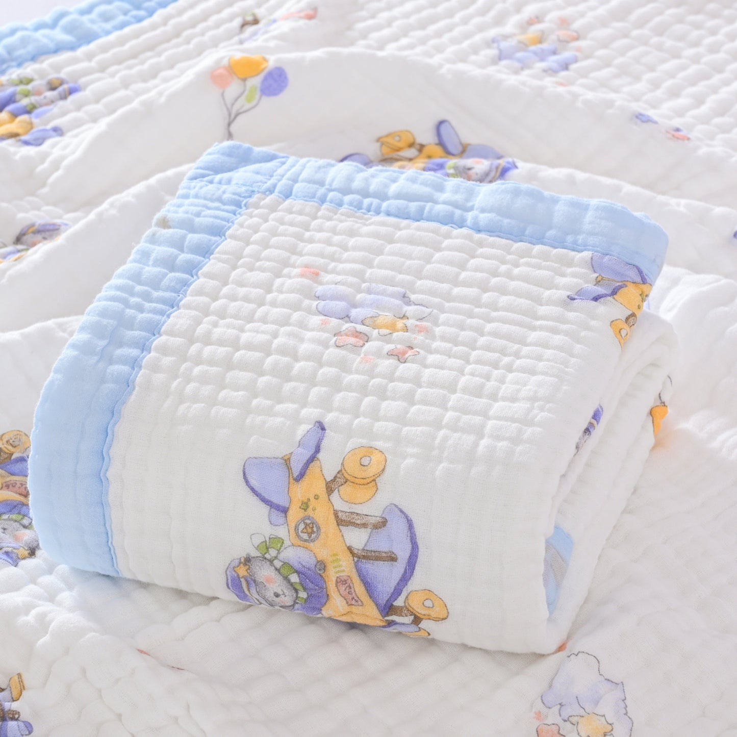 This multipurpose contemporary throw blanket is made of 6 layers of thick cotton gauze with a cute cartoon pattern. It is hypoallergenic and stain-resistant, making it perfect for use in the bath, for napping, on the bed, or in the office. Please hand