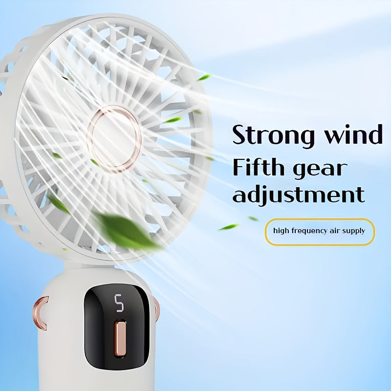 Sleek and stylish white and rose gold Compact & Portable USB Rechargeable Mini Fan with Neck Strap. Perfect for use in the office, classroom, or while traveling. Features a 1200mAh Lithium Battery, desk stand, and includes a power cable for convenient