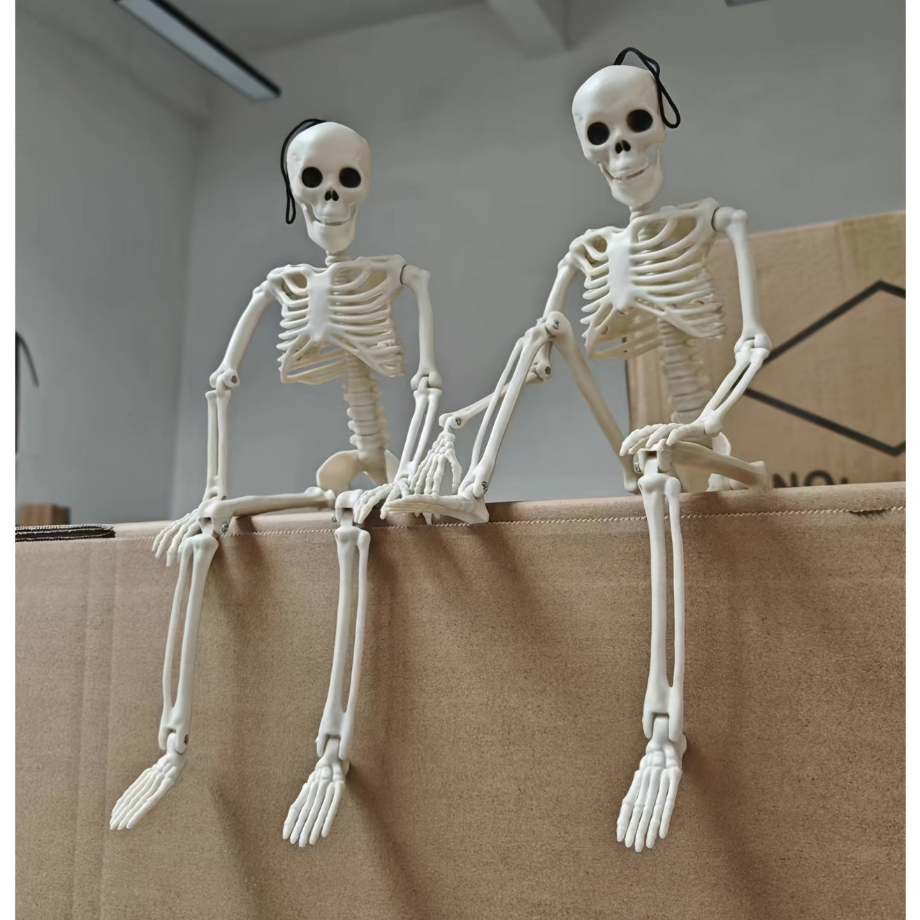 2 Halloween skeleton decorations with posable joints for creepy outdoor decor.