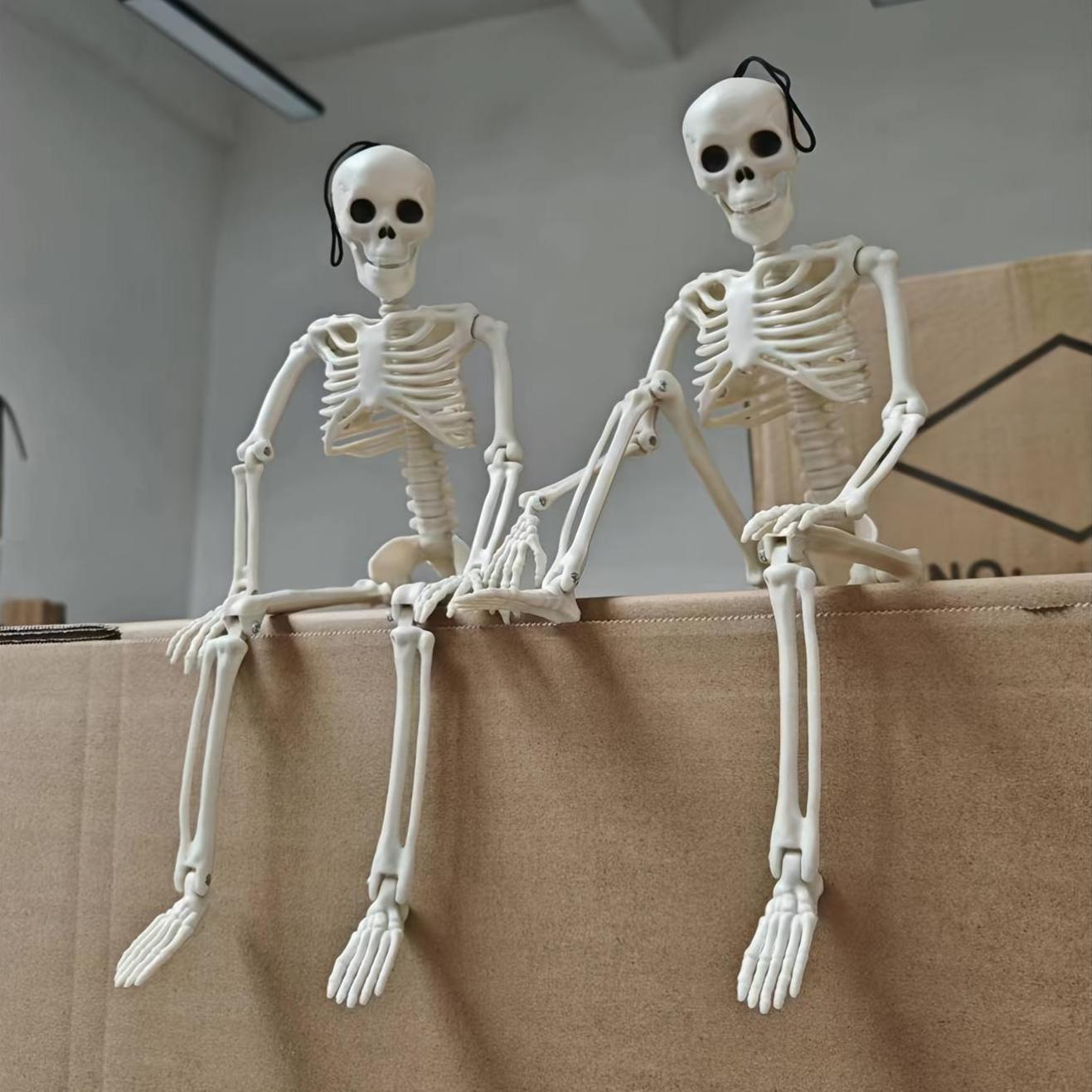 2 Halloween skeleton decorations with posable joints for creepy outdoor decor.