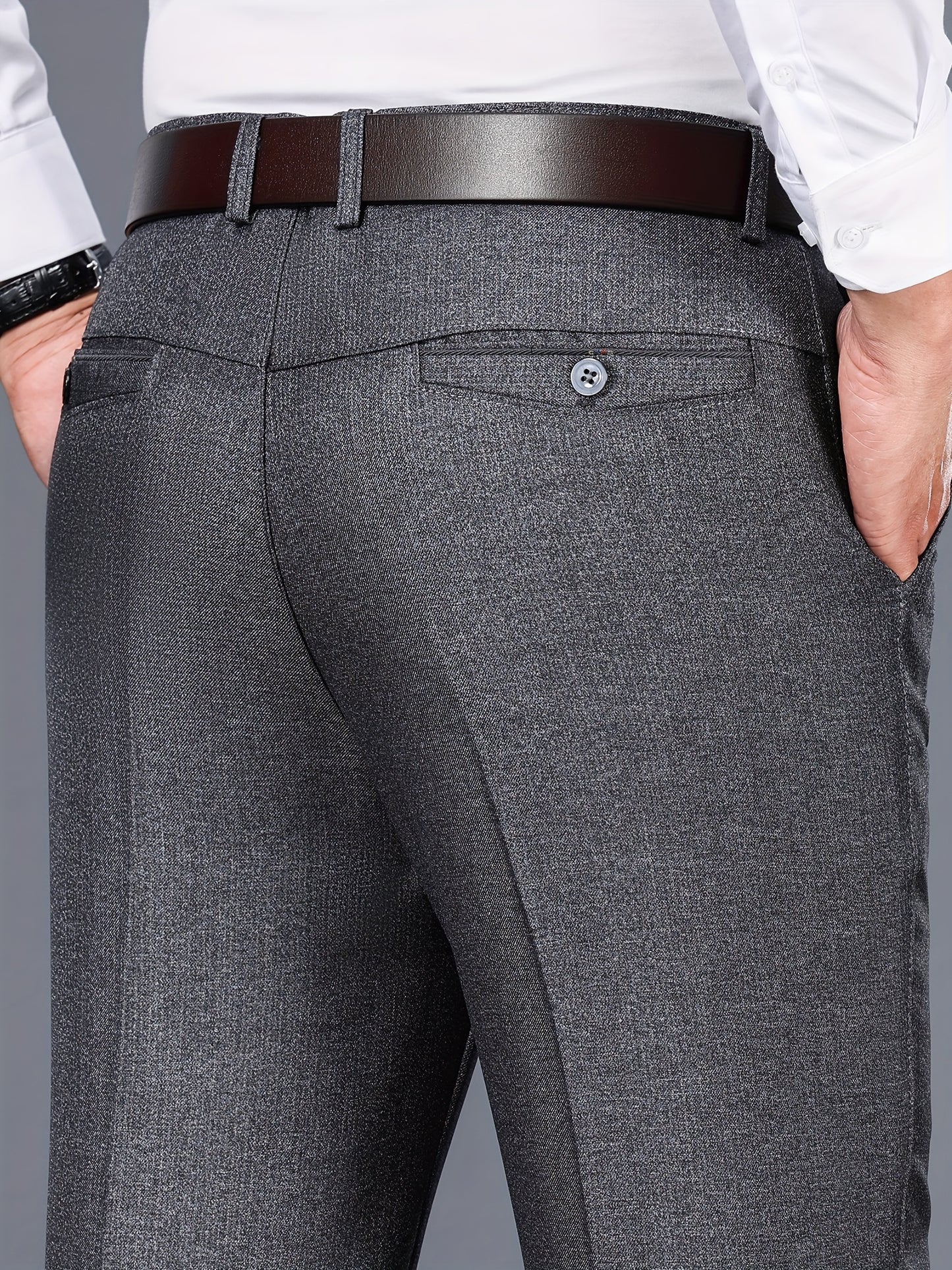 Gray dress pants for men with a straight fit, medium thickness, slant pockets, zip closure, and non-stretch polyester fabric. Suitable for business casual or formal wear in spring and