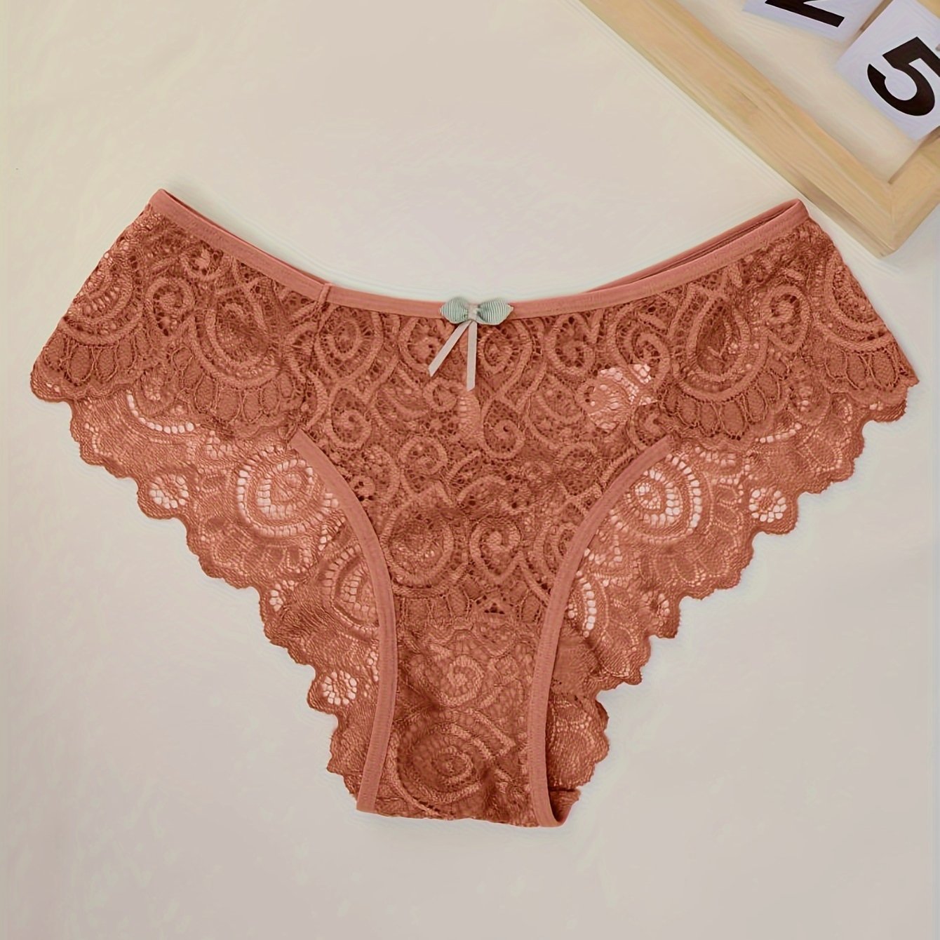 Women's low waist panties made of floral lace with cut outs, breathable and semi-sheer.