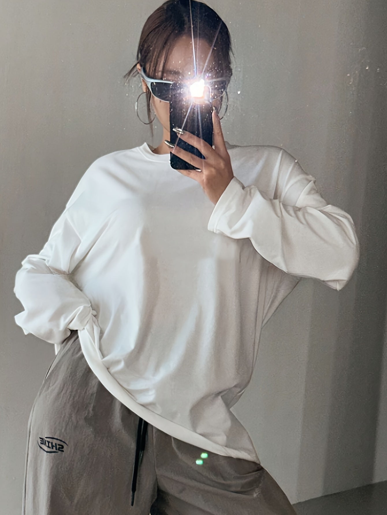 Women's casual crew neck long sleeve t-shirt in white, made of 62% polyester, 34% viscose, and 4% elastane. Regular fit with medium stretch, suitable for fall/winter fashion.