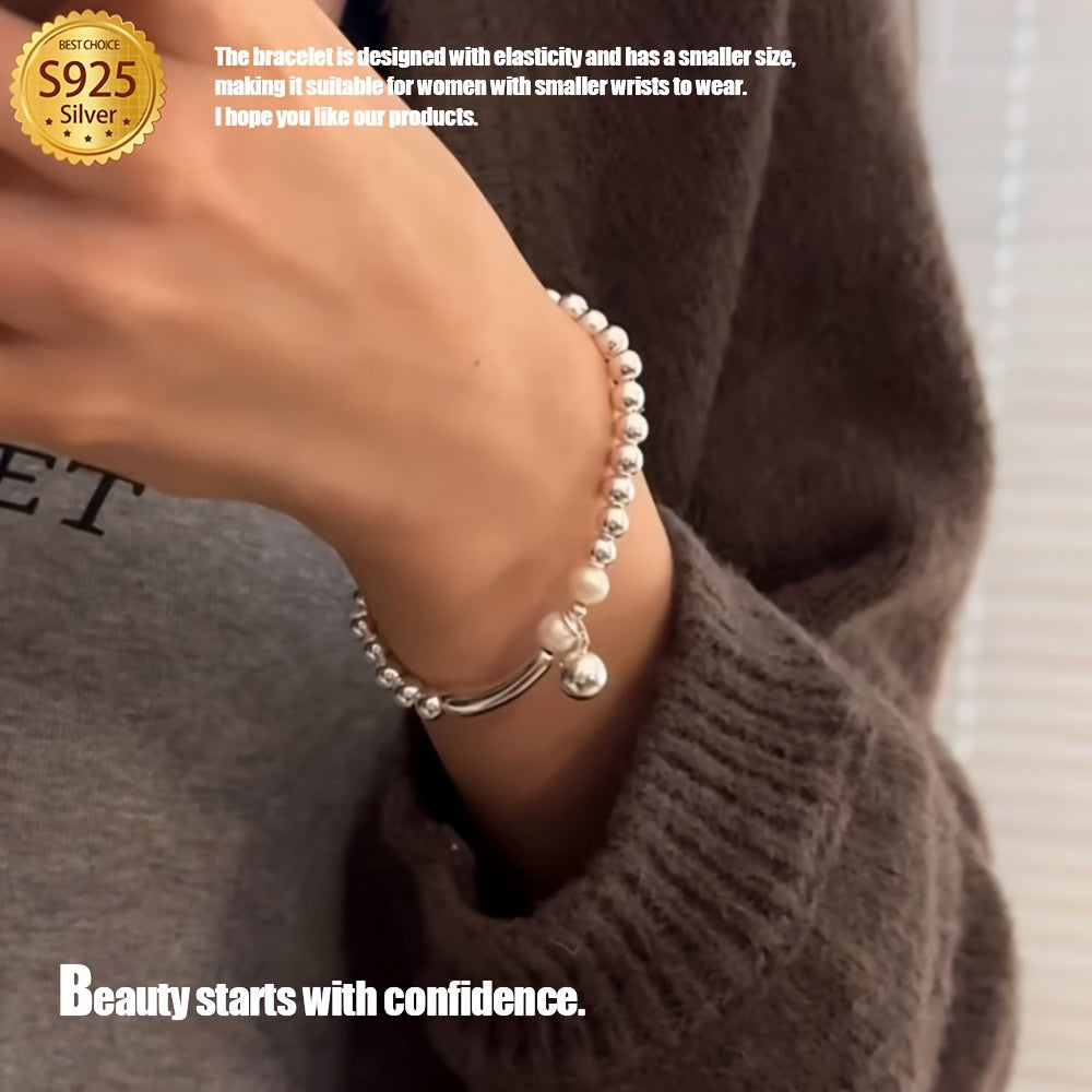 This Elegant Silvery Bracelet features embedded pearls, exuding luxury and sophistication. With a high-end and unique design, it is cool, refreshing, and perfect for those seeking individuality. This exquisite piece is a great gift, guaranteed to bring