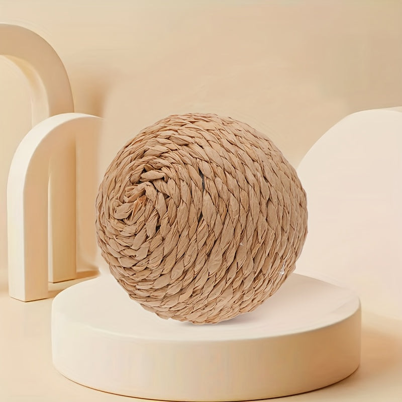 Interactive sound-making cat scratching ball toy made of cardboard material for cats to relieve play with their pet companion.