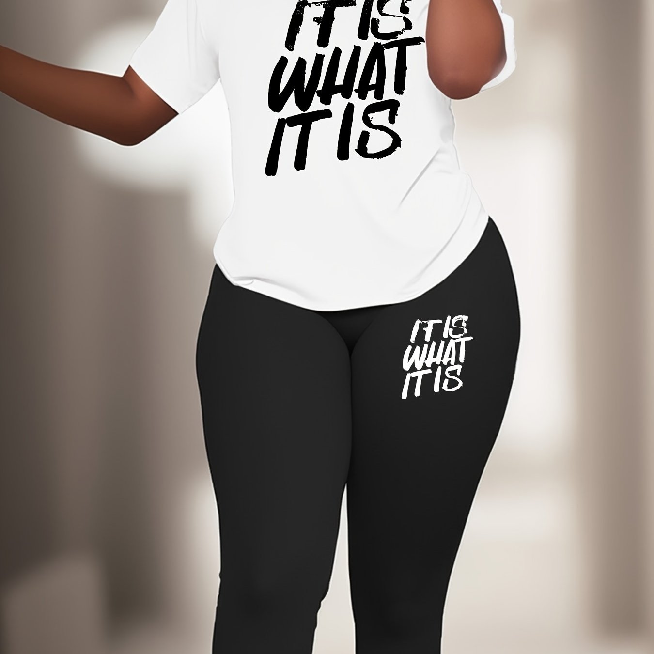 Plus Size Sports Set with slogan print. Polyester knit fabric with elastane for medium stretch. Crew neck activewear lash set.