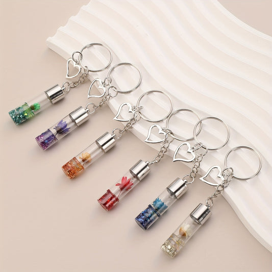 Valentine's Day gift for women: a keychain with 6 flower-filled bottle charms, heart key ring, perfect for adding charm to purses, bags, backpacks, or even as an accessory for earphones in the car.