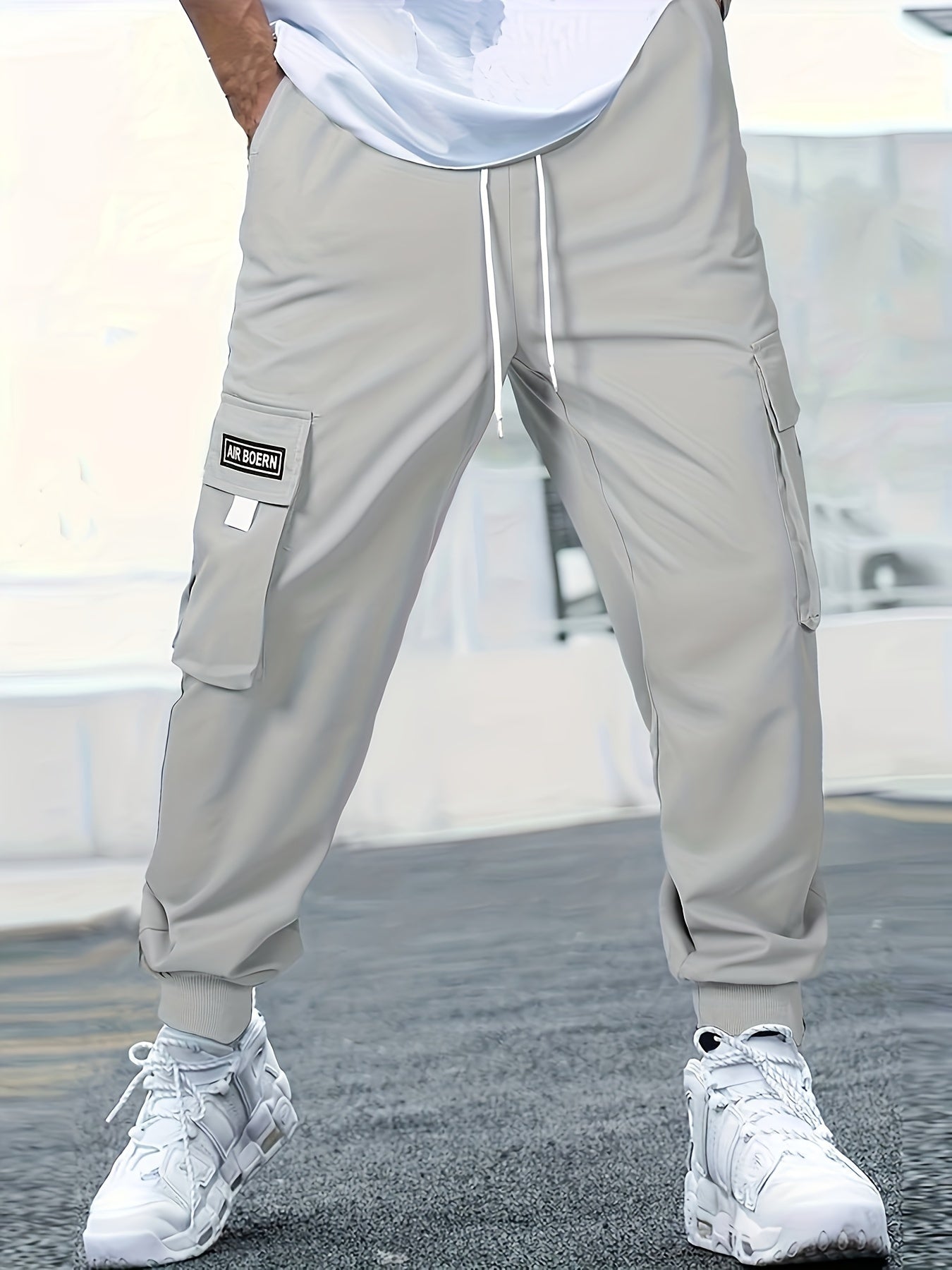 Japanese men's casual work pants with multiple pockets and loose, tied feet for spring 2023