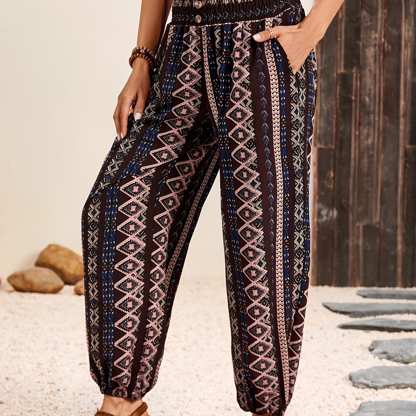 Ethnic style printed pants for women with pocket, button, and elastic waist in plus-size.