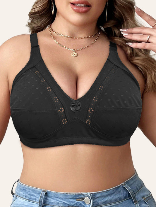 Elegant beige bra for plus size women with full coverage, wireless design, front bow detail, and floral cut-outs. Made with a soft nylon blend, wide straps, and no padding. Versatile for