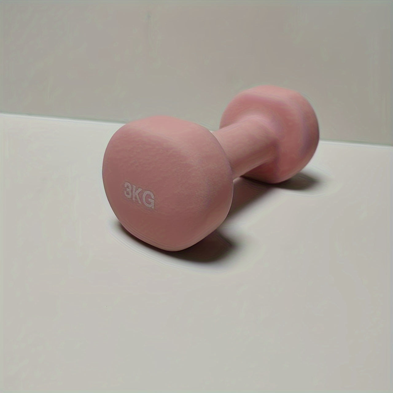 1pc 2kg dumbbell in pink/blue/black colors, made of solid cast iron for home gym. Durable and stylish fitness accessory for both men and women.