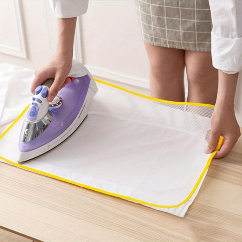 Protect your clothes from heat damage with the Heat Resistant Ironing Net Mat - the perfect home accessory for steam ironing.