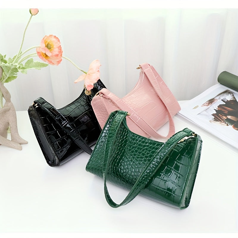 Stylish women's shoulder bag with crocodile embossing, wide strap, solid color, zip closure, phone holder, and available colors in coffee, light brown, pink, green, and black.