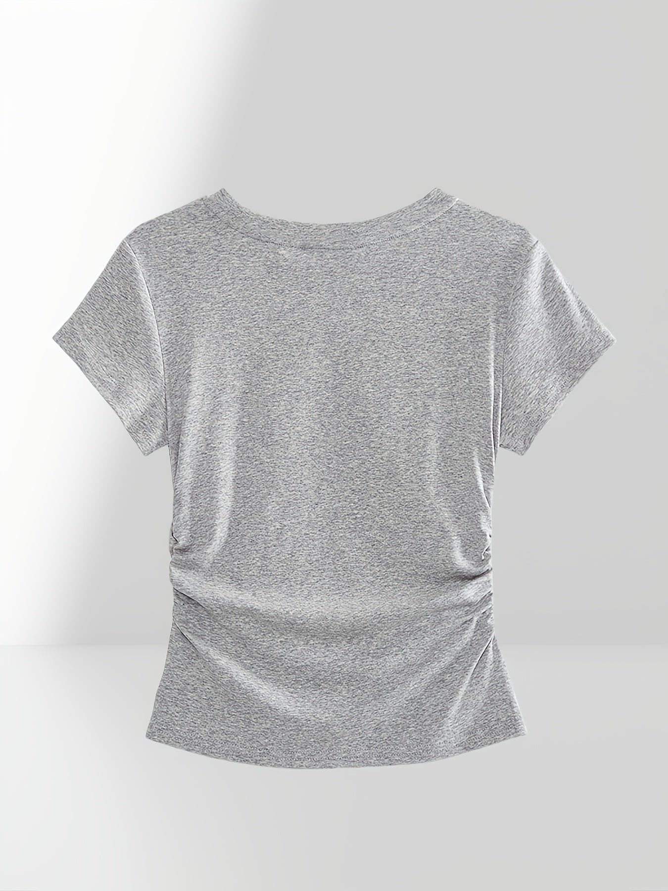 Women's fitted short-sleeve t-shirt with ruffled edges for casual summer wear.