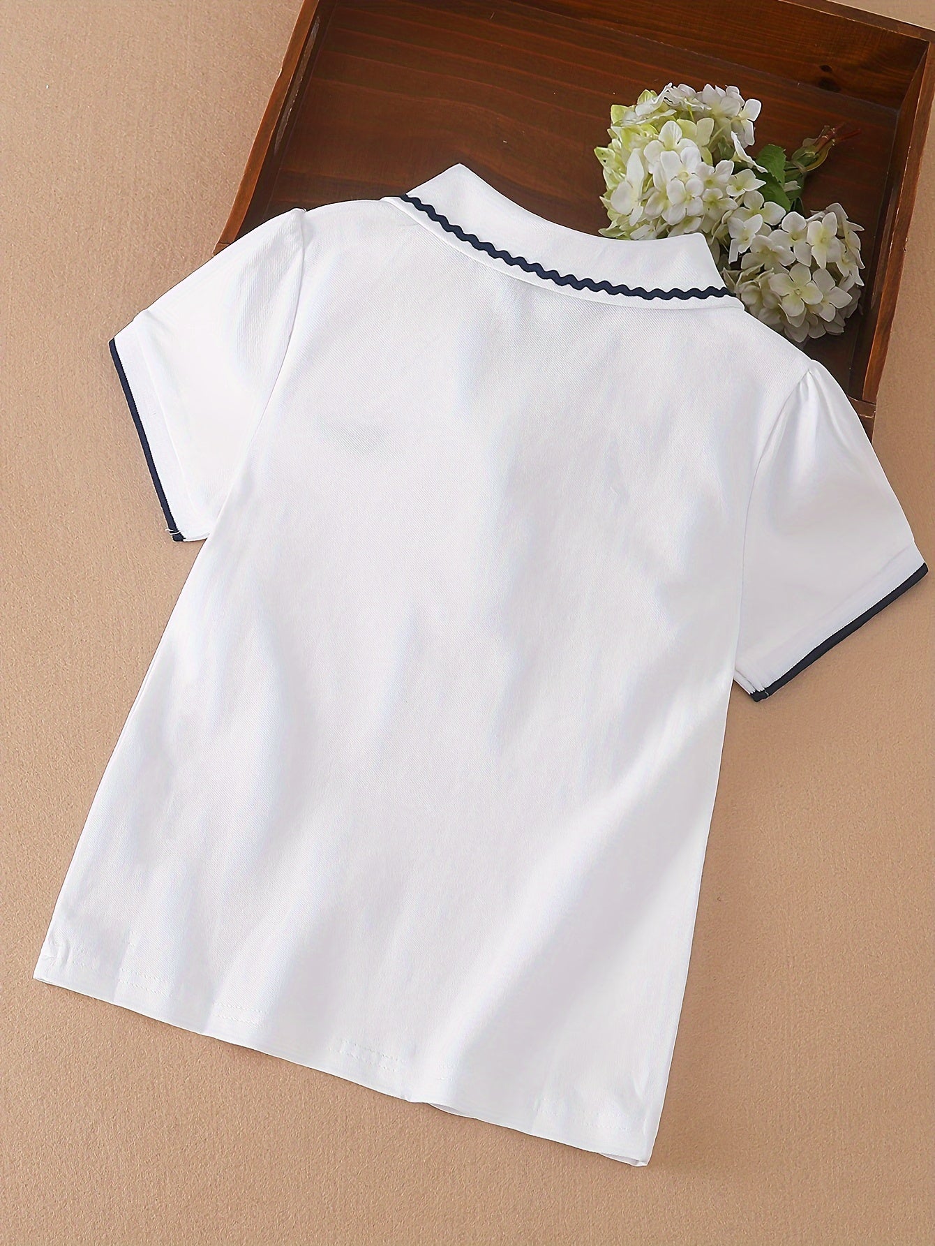 Stylish lace detail on cotton blend girls' shirt - perfect for summer casual wear.