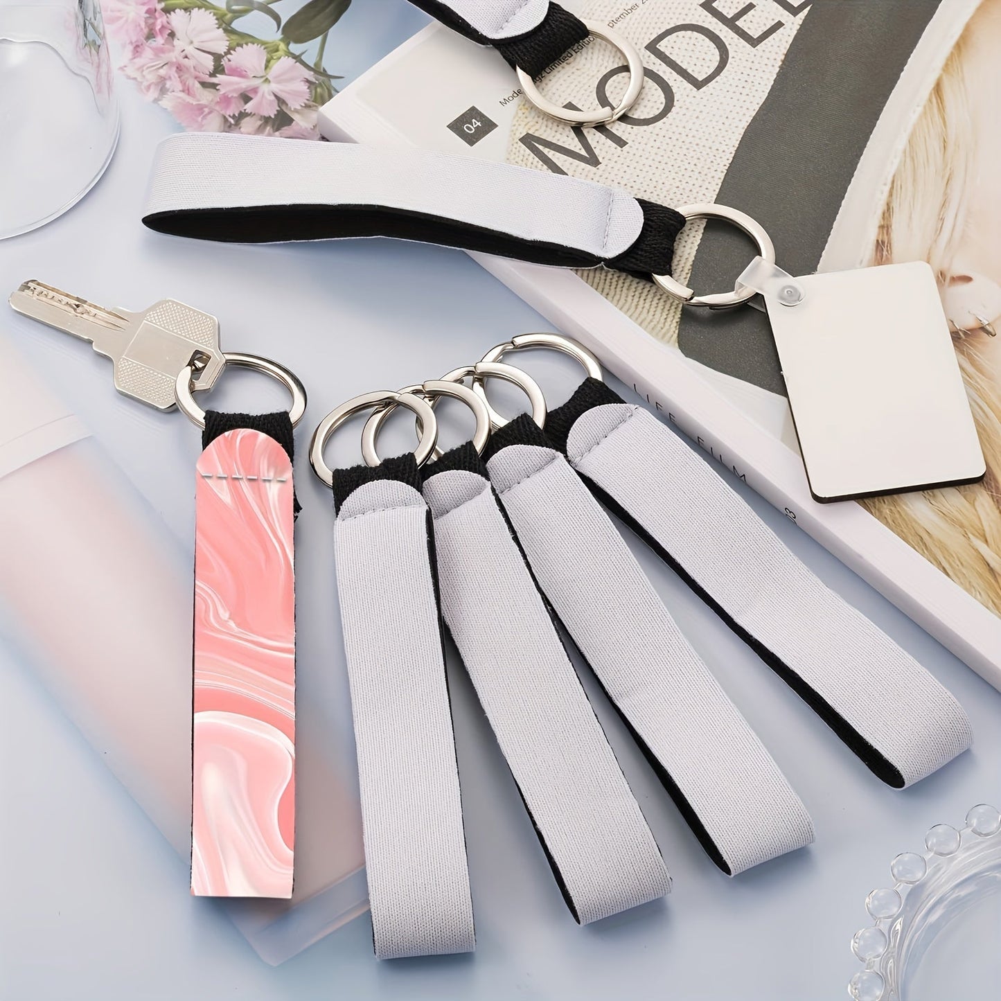 Set of 20 Sublimation Blank Wristlet Lanyards featuring Lipstick Holder Keychains. These lanyards are made of Neoprene material and come with a blank Lipstick Keychain Holder, perfect for Heat Transfer Craft projects.