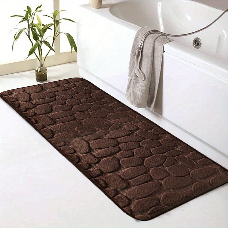 SoftTouch Cobblestone Pattern Memory Foam Bath Mat is machine washable and non-slip, making it a perfect addition to any bathroom. The absorbent polyester material resists stains, making it ideal for use in the bathtub or kitchen. This home decor runner