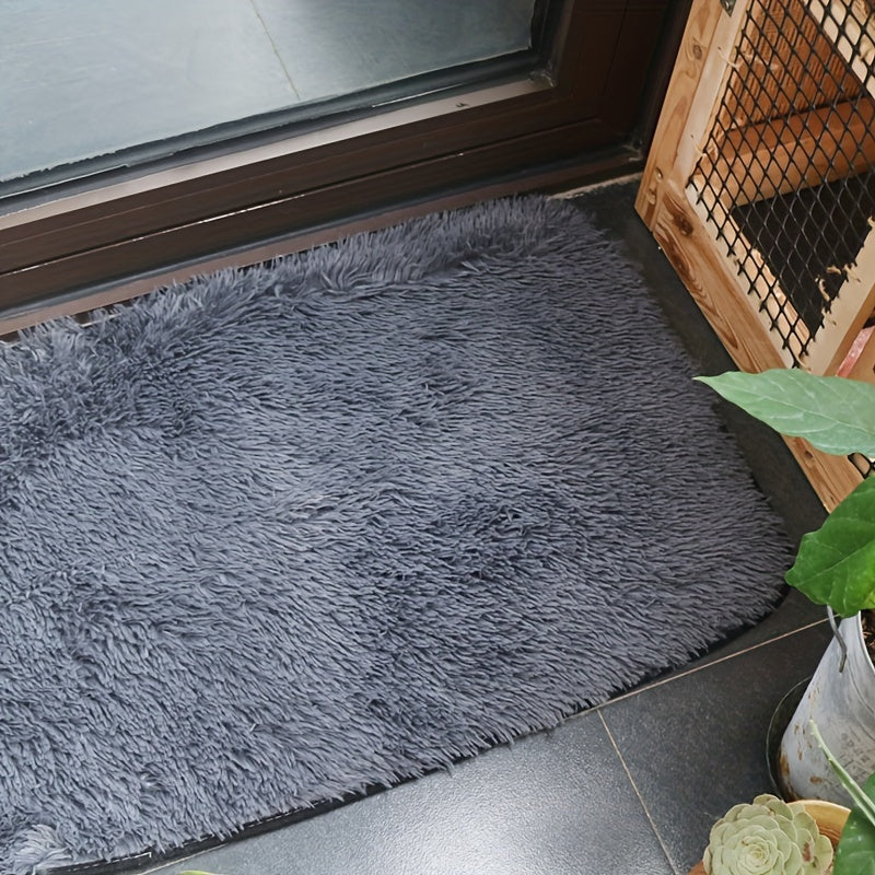 Soft and luxurious light gray plush floor mat with non-slip backing for ultimate comfort and safety. Made of ultra soft, fluffy polyester, this mat is perfect for use in the bedroom, bathroom, or living room. It is machine washable, making it easy to