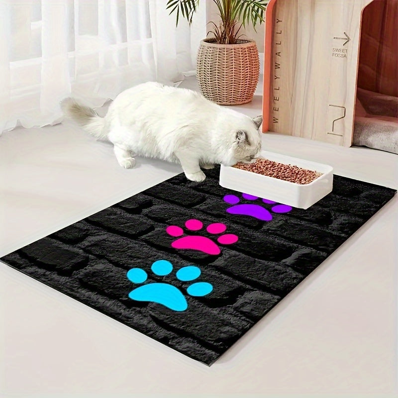 Cute paw print pet feeding mat for indoor/outdoor use, non-slip polyester material, versatile all-seasons accessory for pet food & water bowls.