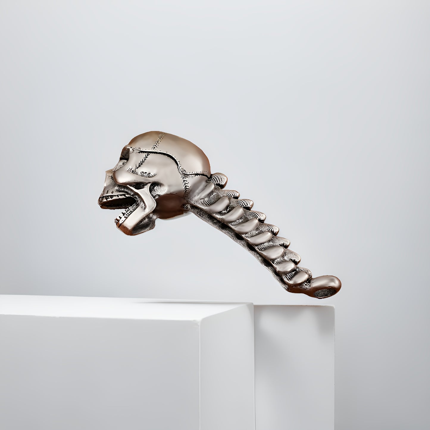 Skull-shaped metal bottle opener for beer and juice, perfect for home and restaurant use.