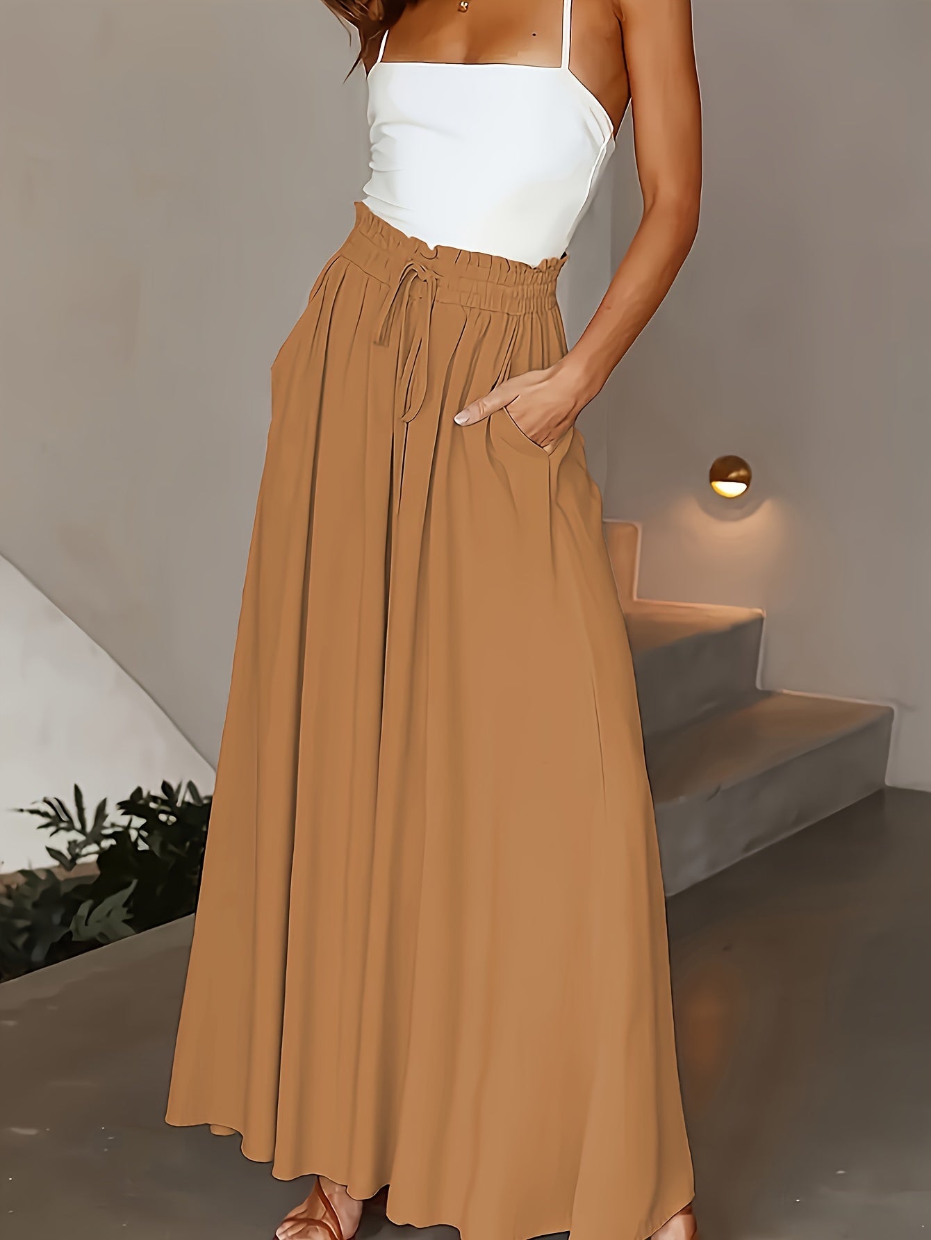 Olive green wide-leg pants for plus size women with high-rise and drawstring waist. Flowy straight cut, machine washable, comfortable for all seasons. Elegant casual style with smooth