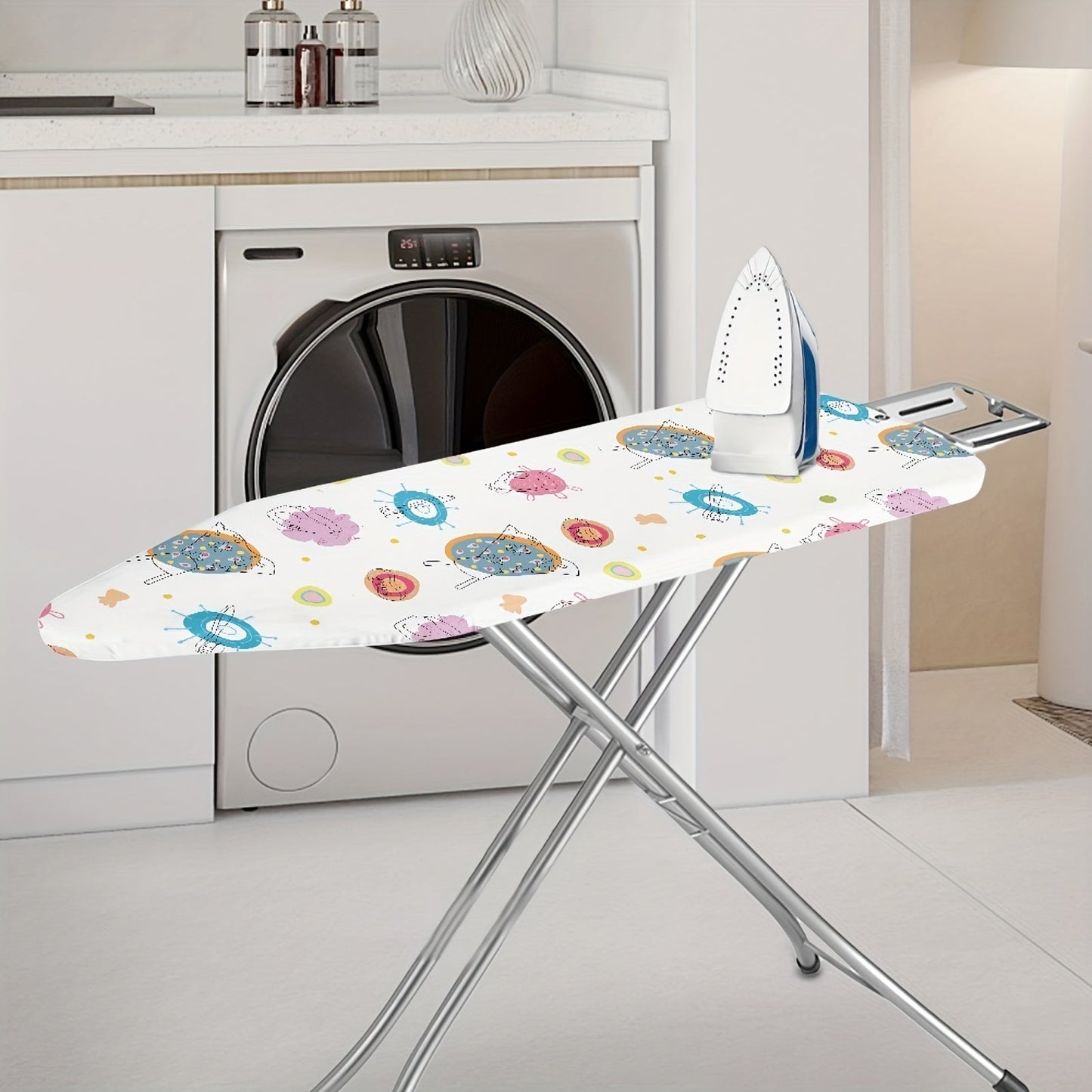 Protect your ironing station with this small items print protective cover, perfect for keeping dust off your laundry while adding a stylish touch to your home accessories. A must-have for any clothing store or laundry room.