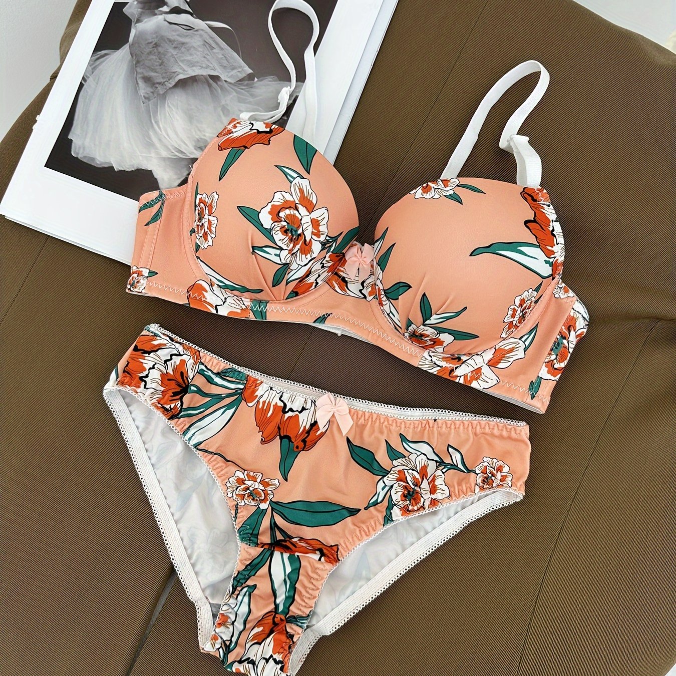 Floral bra and panty set with steel underwire and breast enhancement feature for women.