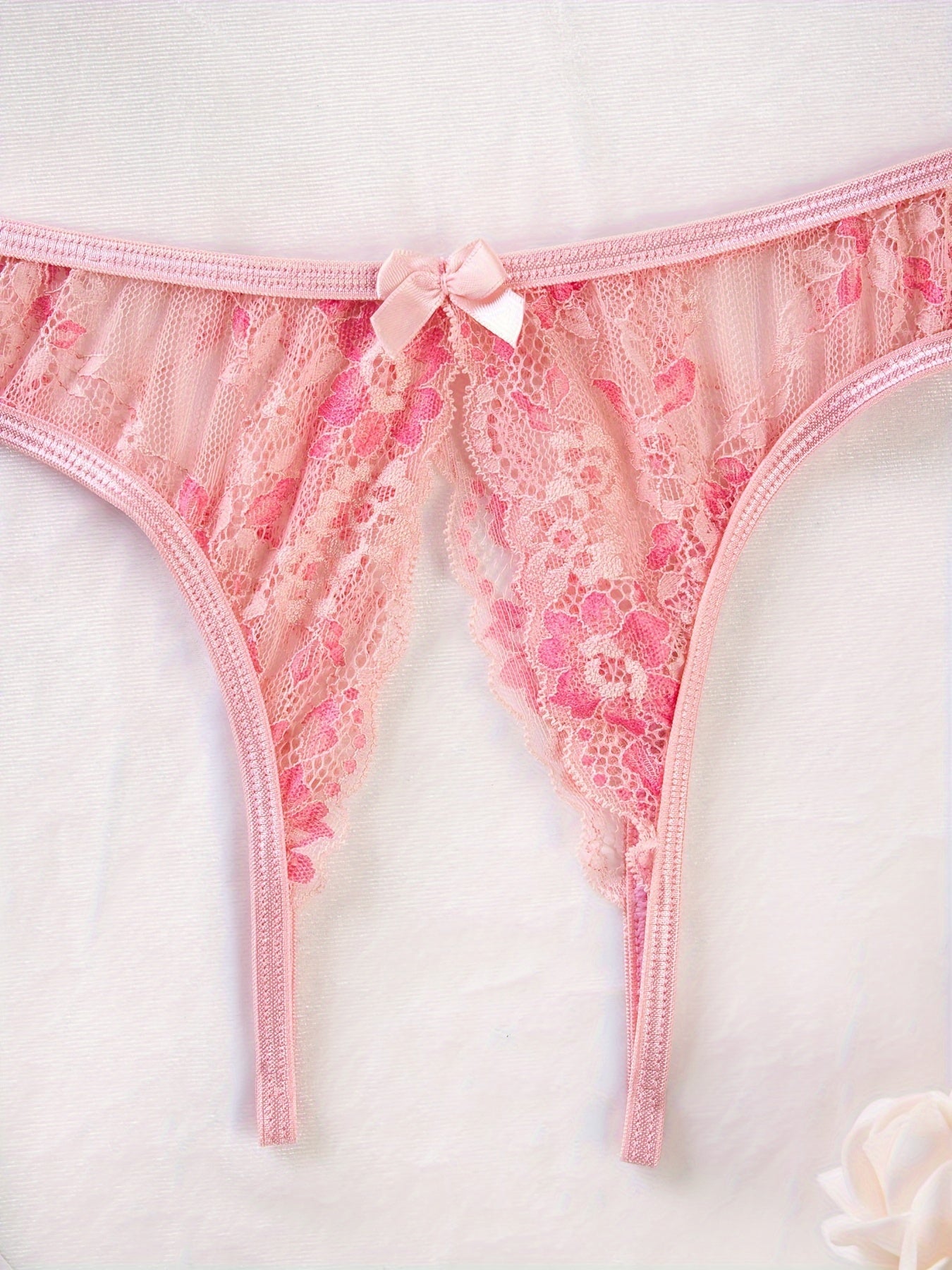 Stylish floral lace panties featuring bow detail, semi-sheer, comfortable fit for plus size women. Cute and fashionable.