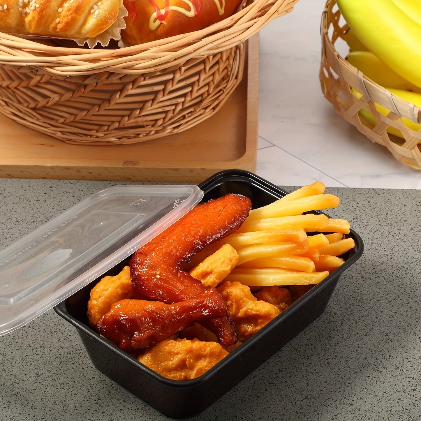 30 pieces of plastic black boxes with lids in 17, 22, and 26 ounce sizes. These rectangular food storage containers are BPA free and come with leakproof covers. They are stackable and microwave-safe, making them ideal for storing food. Perfect for use as