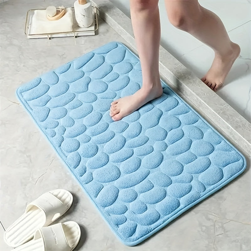 Soft, non-slip coral fleece bathroom mat in a pebble pattern. Quick-dry, machine washable, and low pile for comfort and home decor. Made of plush polyester fiber with knit fabric and 100% polyester material. 570gsm and 1.4cm thick.