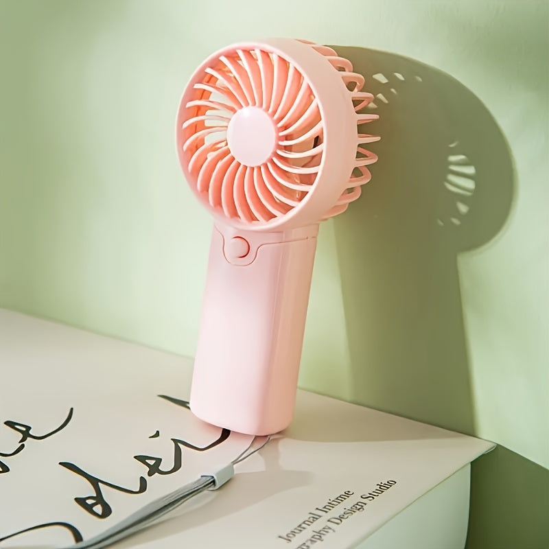 Portable Mini Fan - Lightweight and Battery-Powered Handheld Fan for Outdoor and Travel Use; AAA Batteries Sold Separately