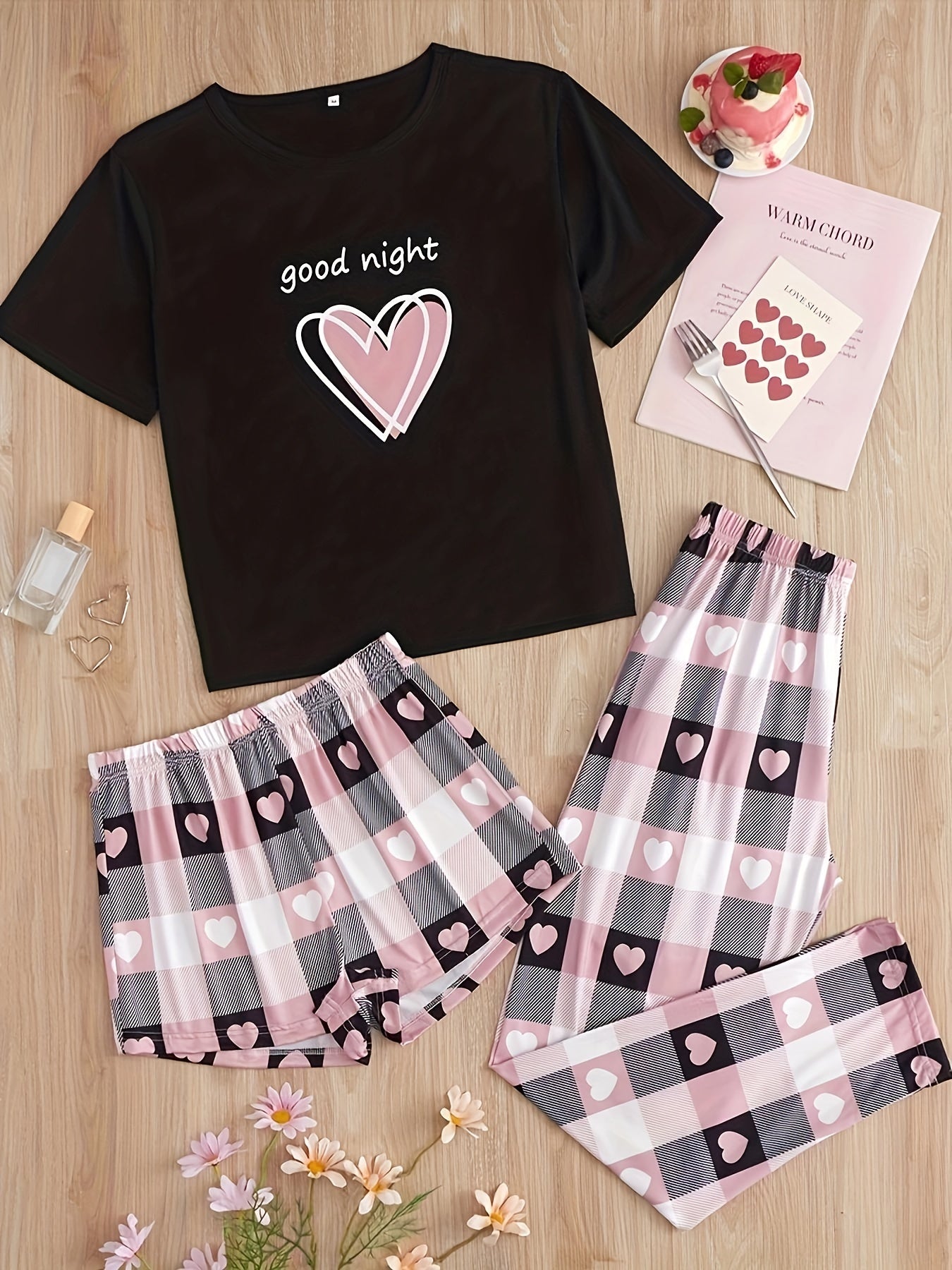 Women's casual pajama set with heart and plaid print, slogan, short sleeve top, and relaxed fit.